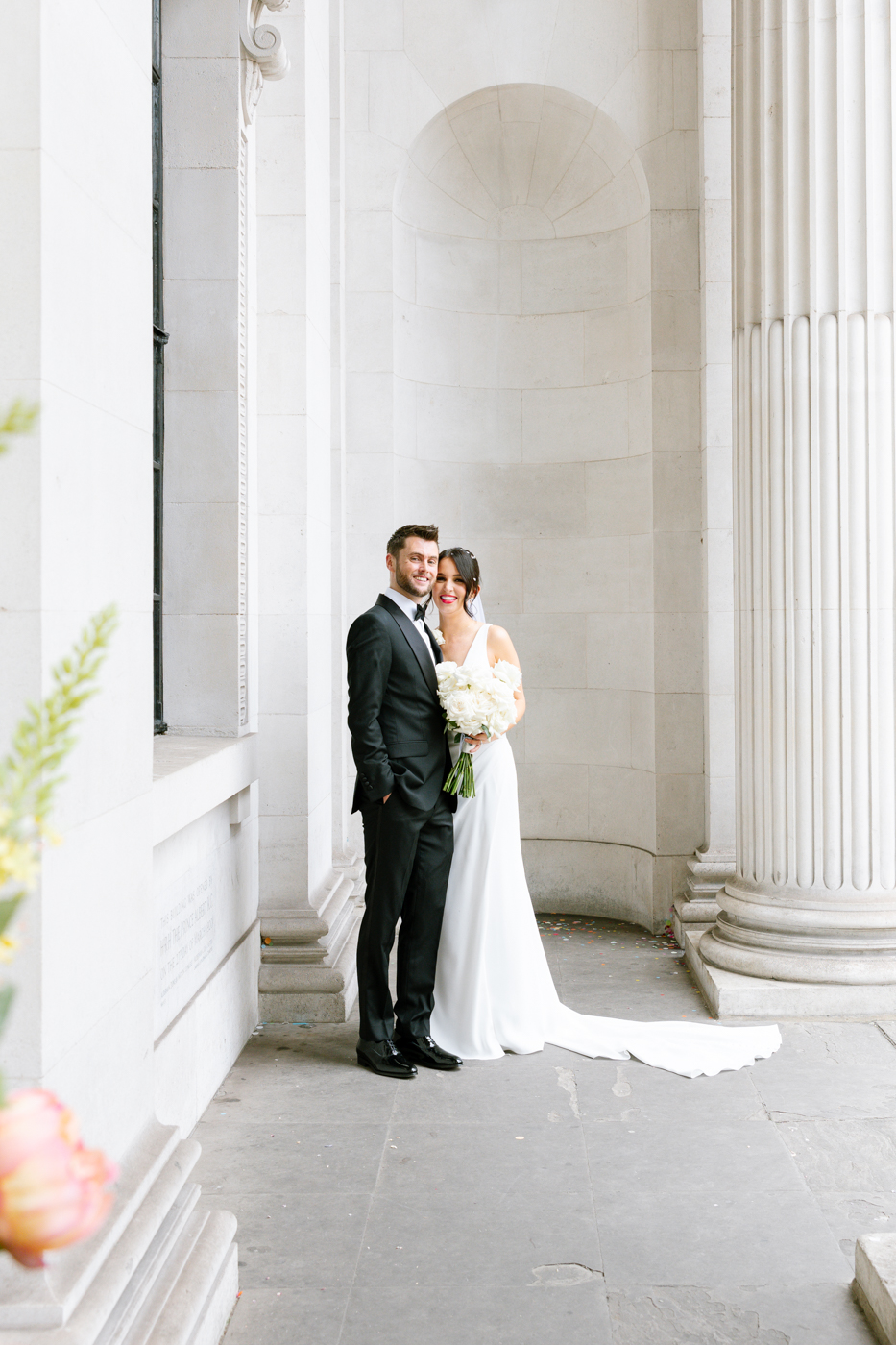 NATHALIE DELENTE PHOTOGRAPHY-18 black and white image of bride and groom sat on the sunloungers - editorial wedding photography style